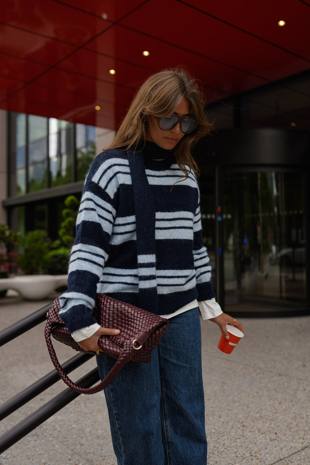 Striped sweater with wide-leg jeans