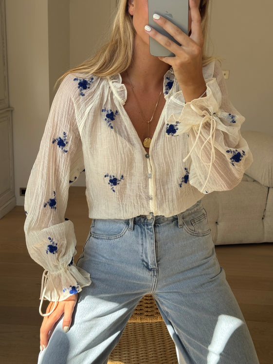 blue blouse dress with flowers cuffed sleeves Ecru and Blue Floral Sheer Blouse with Embroidered Flowers, Long Sleeves & Seashell Buttons – Gabrielle Blouse by EASY CLOTHES – Size M-L